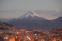 Sunset View Of Quito Ecuador With The Cotopaxi Volcano In The Background