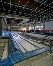 Swimming pool lies empty in an abandoned sports facility in Detroit Michigan