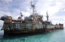 That abandoned look BRP Sierra Madre stands watch  x  while aground on Ayungin Shoal to maintain the Philippines territorial claim in the area Originally USS Harnett County LST- Image credit Chiara Zambrano ABS-CBN News 