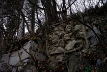 The Abandoned Studio of Bulgarian Sculptor Ivan Funev all thats left are a metal fence and scattered sculptures in the forest as nature reclaims its ground 