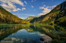 The beautiful waterfalls of Sognefjord Lake in Sognefjellsvegen Norway Photo by Alireza Behrooz 