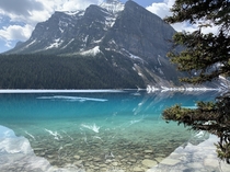 The clear and distinct reflection of the Canadian Rockies on Lake Louise 