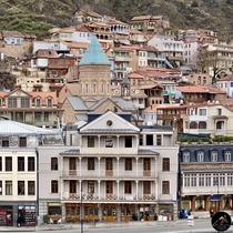 The colorful balconies of Old Tbilisi Republic of Georgia  with Surpgevorki Armenian Church centered 