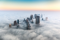 The Dubai skyline above the clouds Photo by Bjoern Lauen 