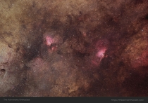 The Eagle and Omega Nebula in a sea of dark dust