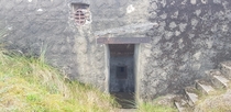 The entrance to an abandoned bunkerAAANaval gun position from nazi germany in Denmark as part of the Atlantic wall Should I post some pic of interior and exterior