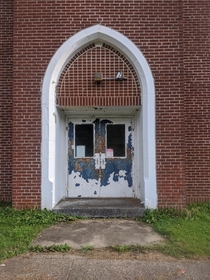 The entrance to an abandoned school