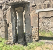 The Etruscan Column so-called for its rounded capital and lack of adornment is embedded in the atrium wall of a nd century BCE residence in Pompeii Italy 