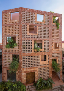 The five-storey Bat Trang House in Vietnam is a layered home encased in a perforated ceramic wall with a series of elevated gardens that function as a natural cooling system It represents the pottery and ceramic heritage of the pottery village of Bat Tran