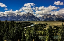 The Grand Teton mountains as seen from the famous Snake River overlook on a sunny summer afternoon Wyoming 