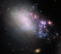 The irregular galaxy NGC  shows all the signs of having been involved in a hit-and-run accident with a bypassing galaxy Rather than destroying the galaxy the chance encounter is spawning a new generation of stars and presumably planets 