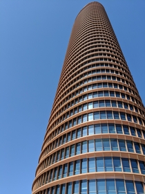 The  m tall Sevilla Tower in Spain was completed in  and is designed by Csar Pelli