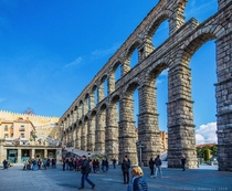 The massive Roman aqueduct bridge of Segovia in Spain still stands tall over the town today Almost m in height it uses no mortar or cement between the  blocks of stone which remain standing solidly in a perfect balance of forces
