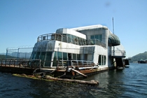 The McBarge AKA The McDerelict is a floating McDonalds restaurant that was built for the  Worlds Fair in Vancouver There have been proposals to turn it into a paddlewheeler or a homeless shelter but for now it rusts away in Burrard Inlet  by Taz