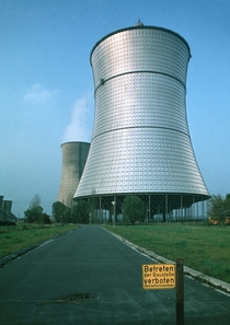 The metallic cooling tower of the THTR- FBR in West Germany which worked from - before being shut down