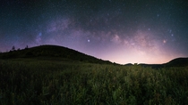 The Milky Way over a summer field in the Blue Ridge Mountains 