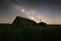 The Milky Way rises over an abandoned farm in Iowa