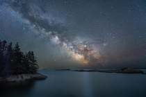 The Milky Way showing its colors over the darkest stretch of the Maine coast 