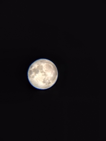 The moon at its roundest peak Taken with my toys r us telescope from my bedroom window 