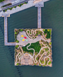 The newly opened Little Island is a free public park in Manhattan New York City that is perched above the Hudson river on  concrete tulips