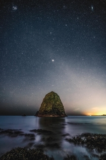 The night sky with Venus Pleiades and Andromeda over a rock formation in Ireland  x