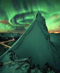 The Northern Lights over a mountain in Norway