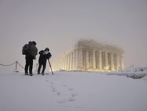 The Parthenon covered in snow last night in Athens Photo credits in comments