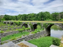 The partially-demolished Richmond Aqueduct carrying the Erie Canal across the Seneca River Montezuma NY USA 