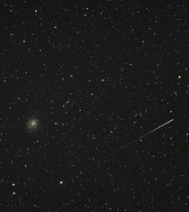 The Pinwheel Galaxy photobombed by a meteor