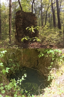 The remaining chimney and well from a cabin from the early s