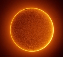 The Space Station Crosses a Spotless Sun by Rainee Colacurcio
