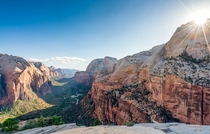 The sun bursting over the main canyon in Zion National Park from Angels Landing x