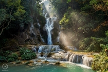 The Tadklangsi Waterfall In Laos  by Jaruwat Pulsup