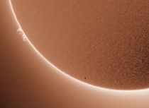 The tiny black dot is Mercury in front of the Sun
