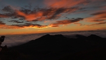 This blazing sunset  miles atop of Mt Haleakala Maui Hawaii 