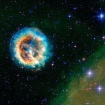 This image of the debris of an exploded star - known as supernova remnant E - or E for short - features data from NASAs Chandra X-ray Observatory E is located about  light years away in the Small Magellanic Cloudone of the nearest galaxies to the Milky Wa