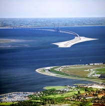 This is the bridge connecting Denmark and Sweden They made a tunnel not so ships could pass but so it doesnt interfere with the air traffic of Copenhagen Airport 