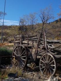 This old wagon and abandoned mine shaft in the background Pic snapped in Nevada