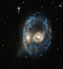 To celebrate Halloween Hubble has released an image of two colliding galaxies that resemble a ghostly cosmic face The image is an example of pareidolia where the human mind attempts to piece together a familiar pattern when no such pattern exists
