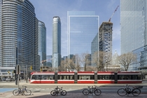 Torontos waterfront streetcar runs beneath the gleaming skyscrapers of the downtown 
