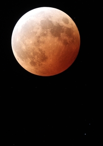 Totally eclipsed Moon shows a range of color across a well-exposed telescopic view of the lunar eclipse Shot over the Santa Cruz Mountains near Los Gatos California 