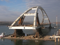 Transporting the tied-arch span of the Pentele M Bridge on the Danube River Hungary  
