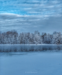 Trees reflecting in the Mississippi River Ontario Canada on a cold winter morning  OC