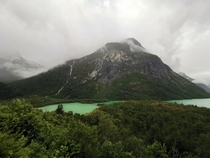 Turqoise lake Loen Norway during a cloudy day 
