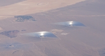 Two solar power installations in the Mohave Desert from a flight 