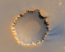Victoria Crater imaged with the HiRISE camera aboard the Mars Reconnaissance Orbiter Crater is m or about half a mile across 