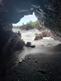 View from a cave at Honokalani Black Sand Beach near Hana HI OC 