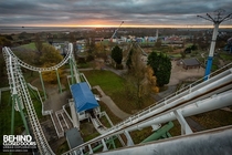 View over an abandoned theme park from the top of the roller coaster link to more pics in comments 