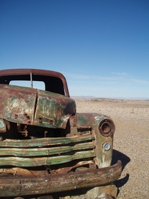 Vintage pickup truck in the middle of the Namibian desert