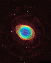 Visible-light observations by NASAs Hubble Space Telescope are combined with infrared data from the ground-based Large Binocular Telescope in Arizona to assemble this composite image of the Ring Nebula